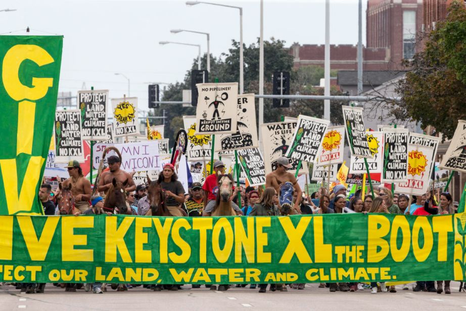 Demonstrators against the Keystone XL pipeline march in Lincoln, Nebraska