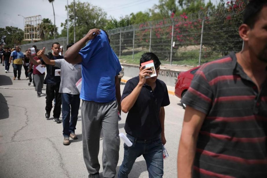 migrants return to Mexico, using the Puerta Mexico bridge that crosses the Rio Grande river in Matamoros, Mexico, on the border with Brownsville, Texas.