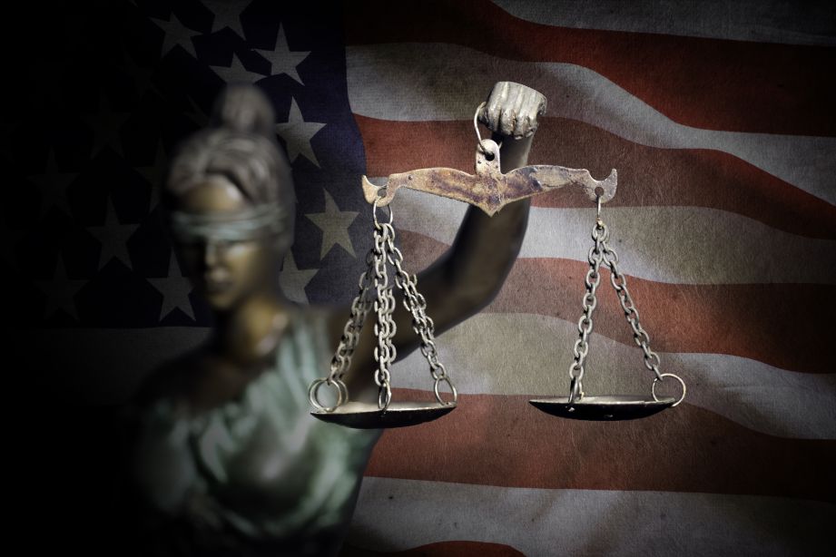 US flag and lady justice holding the scale