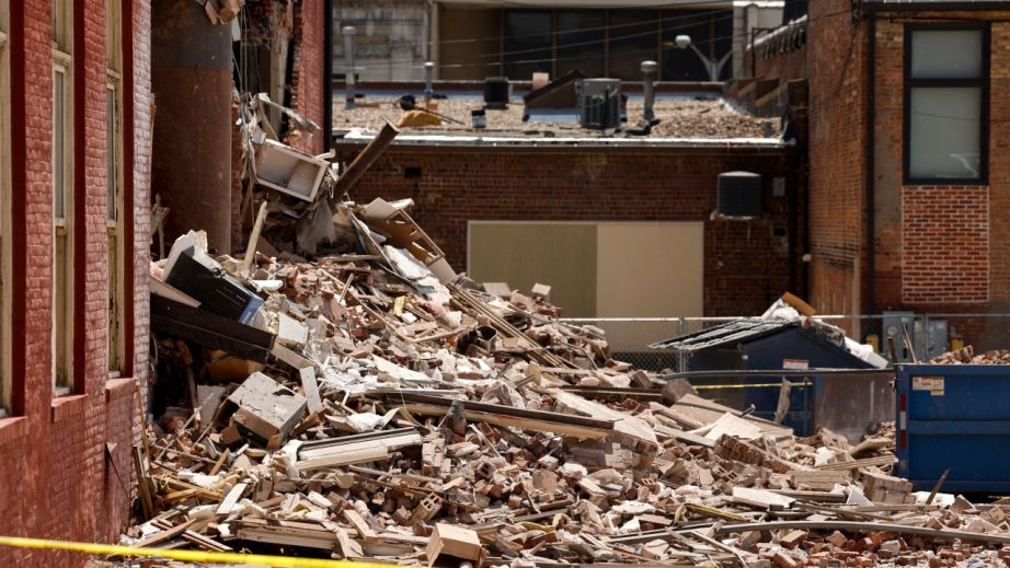 Rubble lies in a pile outside The Davenport on Main Street in Davenport, Iowa, on Monday, May 29, 2023. A section of the six-story downtown apartment building collapsed Sunday. (Nikos Frazier/Quad City Times via AP)