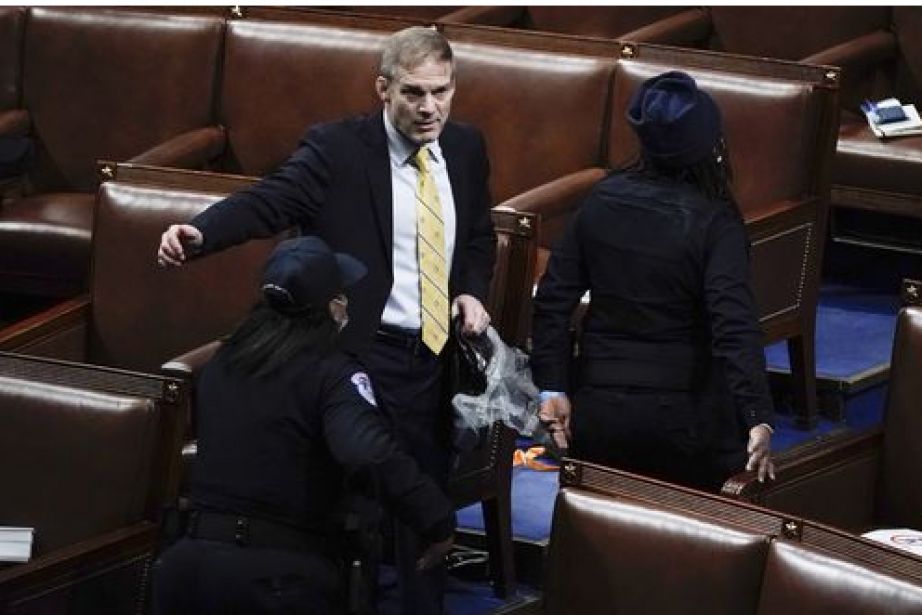 Rep. Jim Jordan, R-Ohio, prepares to evacuate the floor as protesters try to break into the House Chamber at the U.S. Capitol on Wednesday, Jan. 6, 2021, in Washington.