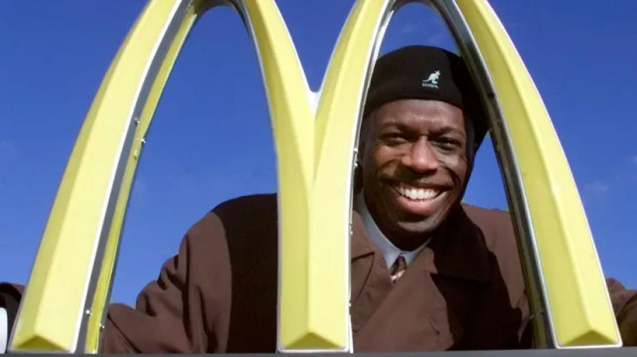 Herb Washington poses outside his McDonalds restaurant in Niles, Ohio, in 2002