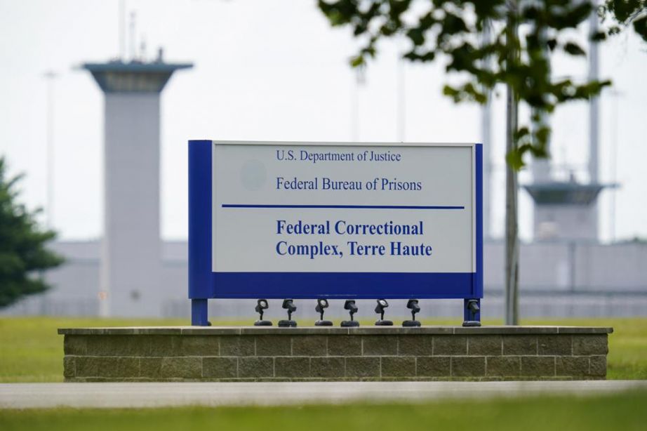 This Aug. 28, 2020, photo shows the federal prison complex in Terre Haute, Ind. An unprecedented string of federal executions likely acted as a COVID-19 superspreader event, just as health experts warned could happen when the Trump administration insisted on resuming executions during a pandemic. (AP Photo/Michael Conroy, File)