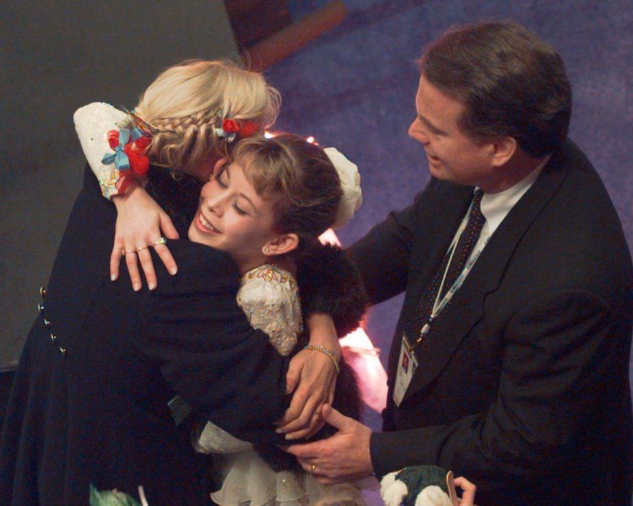 Figure skater Tara Lipinski with her coach Richard Callaghan