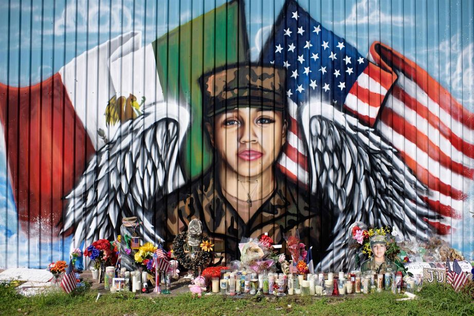 Candles and flowers decorate a makeshift memorial for U.S. Army Spc. Vanessa Guillen at the Power House Gym in Houston, on Aug. 14, 2020.Mark Felix / AFP - Getty Images