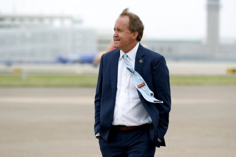 Texas Attorney General Ken Paxton waits on the flight line for the arrival of Vice President Mike Pence at Love Field in Dallas.